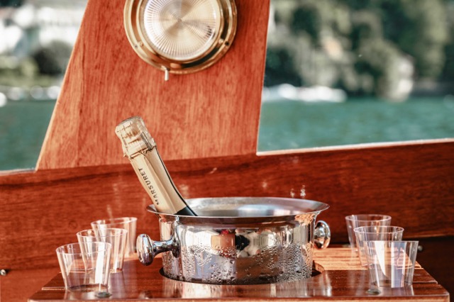 A wine bottle on the boat at lake como