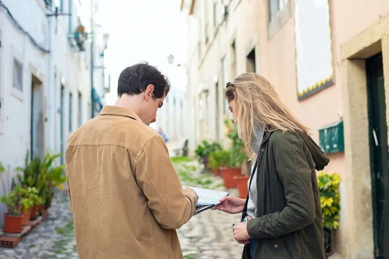 Travel guide helping his customer